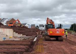 Large excavator digs foundations